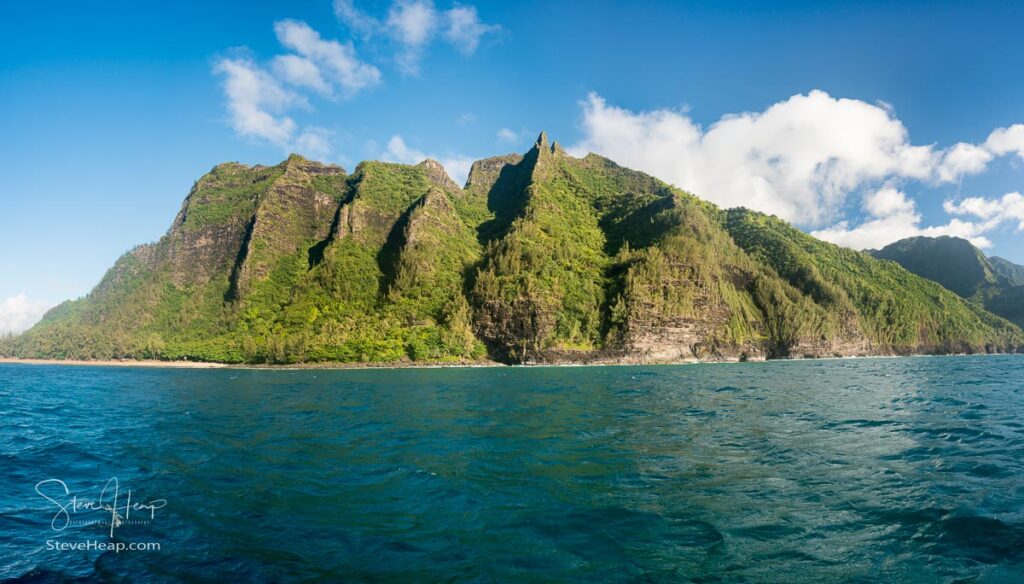 Ke'e beach on the left on Na Pali coastline in Kauai from sunset cruise. Prints available in my online store