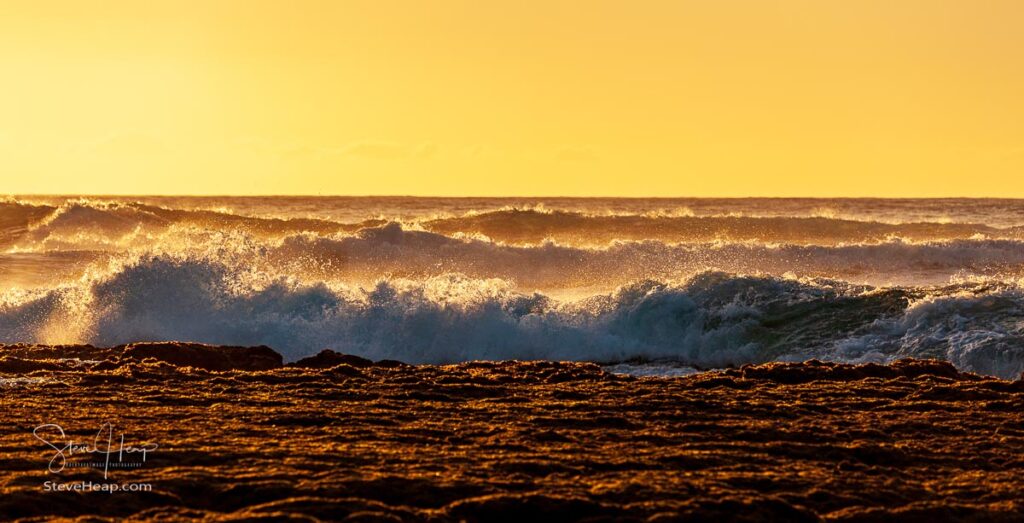 Abstract layered view of the reef, ocean waves and the setting sun sky at Ke'e Beach on the north coast of Kauai. Prints available in my online store