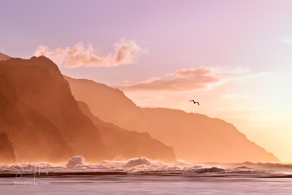 Sun setting over the receding headlands of the Na Pali coast from Ke'e Beach on north of Kauai, Hawaii. Prints available here.