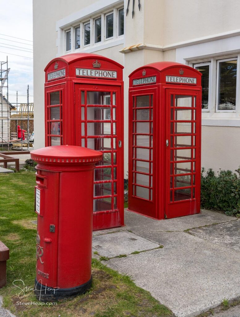 Traditional red telephone boxes and pillar box for mail