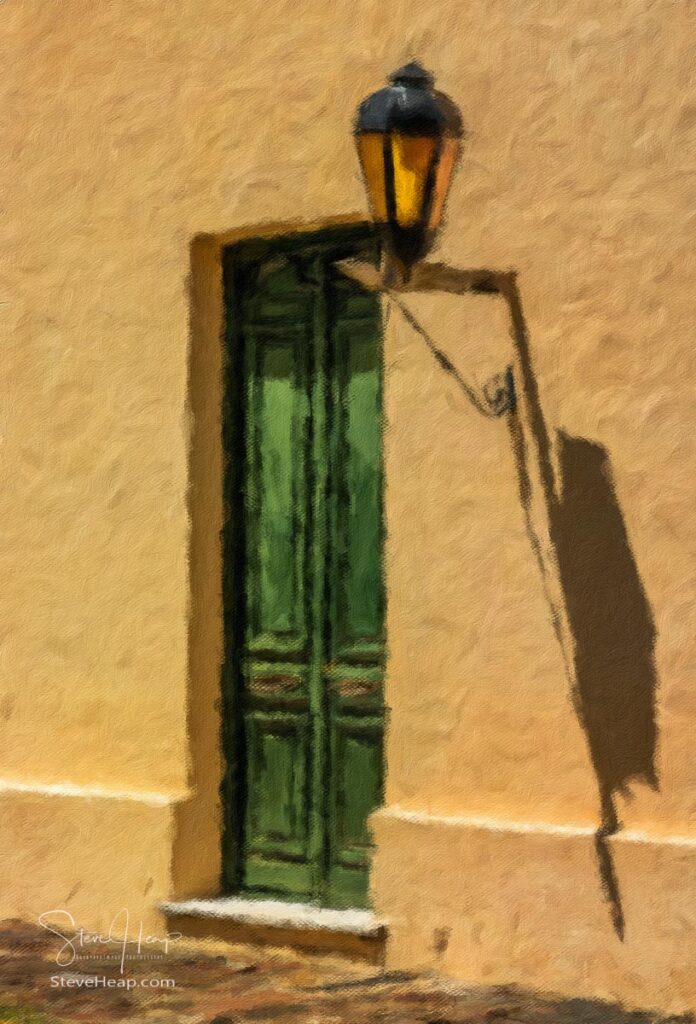 Solid wooden door flanked by the traditional street lantern in Colonia del Sacramento