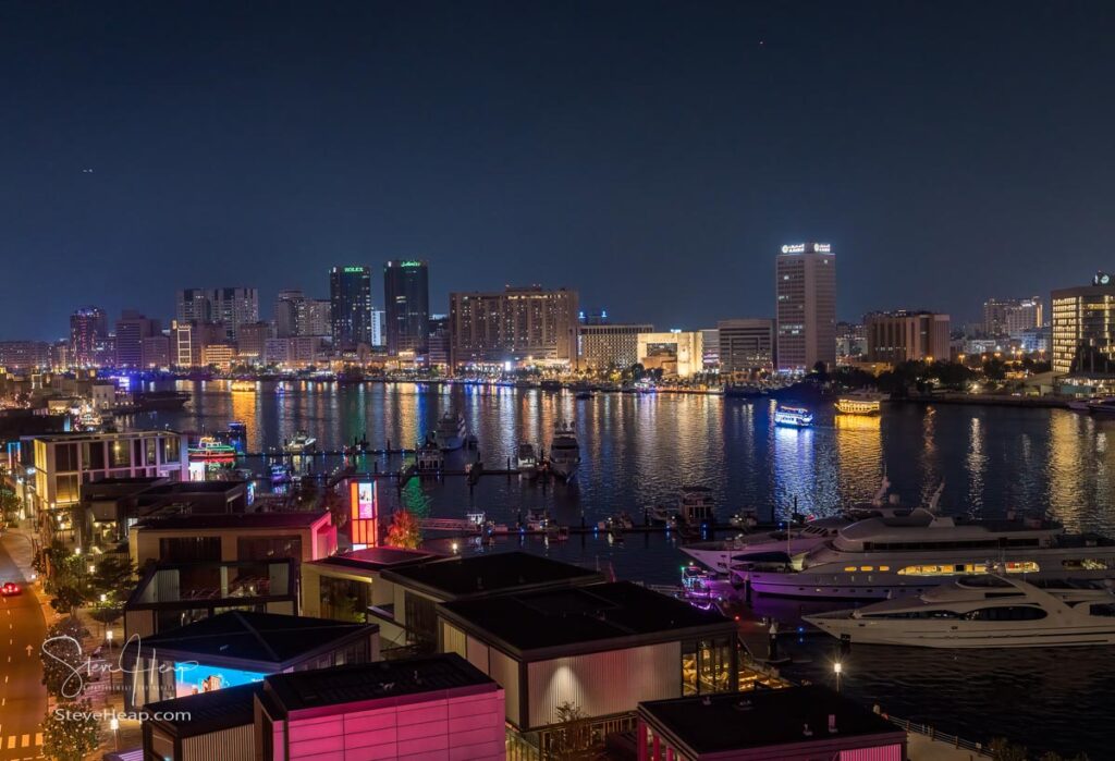 View down the Creek towards Deira as tour boats pass along the water taken from the bar and swimming pool area of the Canopy by Hilton