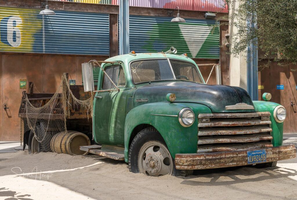 Dubai, UAE - April 1, 2023: Retro rusty Chevrolet truck in shopping street of La Mer by the Gulf coast. Prints in my online store