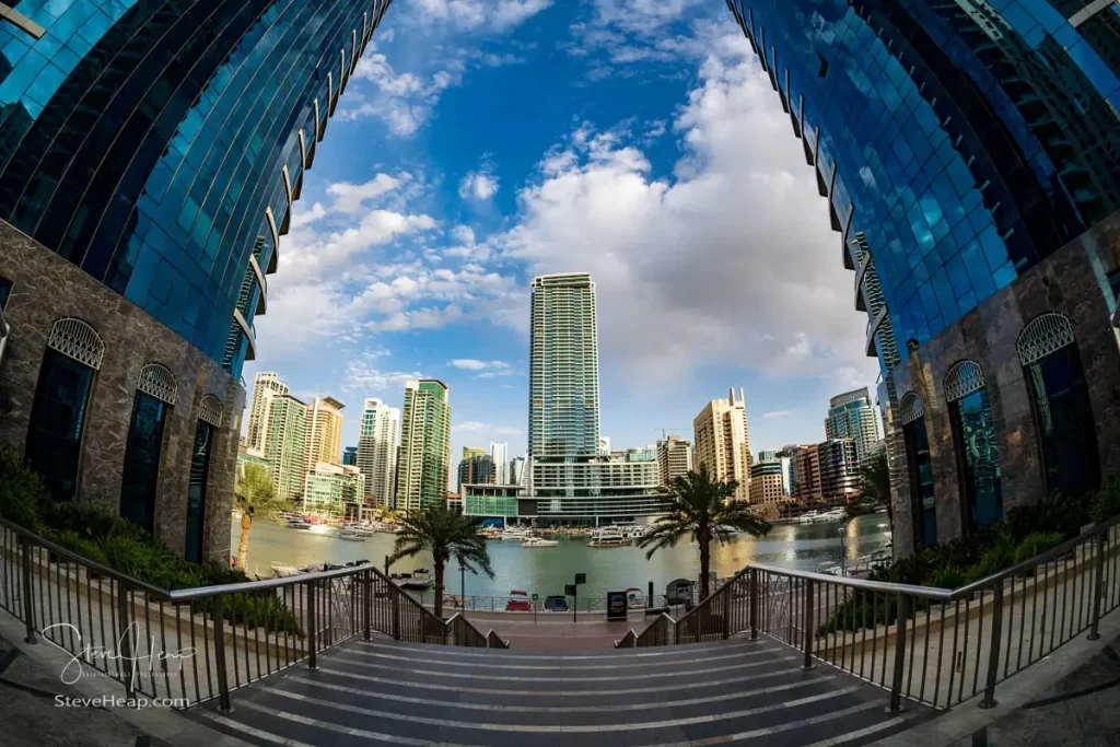 Fish eye view of Dubai Marina from steps leading back towards the beach