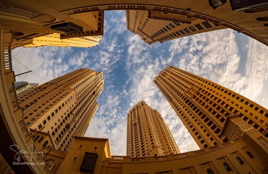 Fisheye view of the many hotel buildings alongside the beach at JBR in Dubai