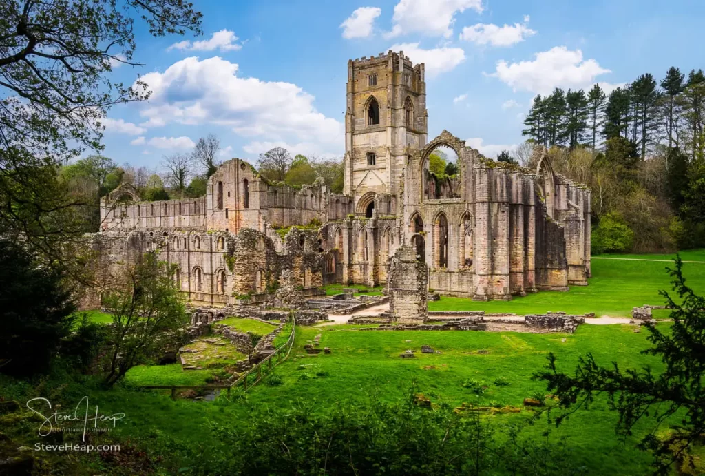 Fountains Abbey through a gap in the trees. USA Prints - UK Prints