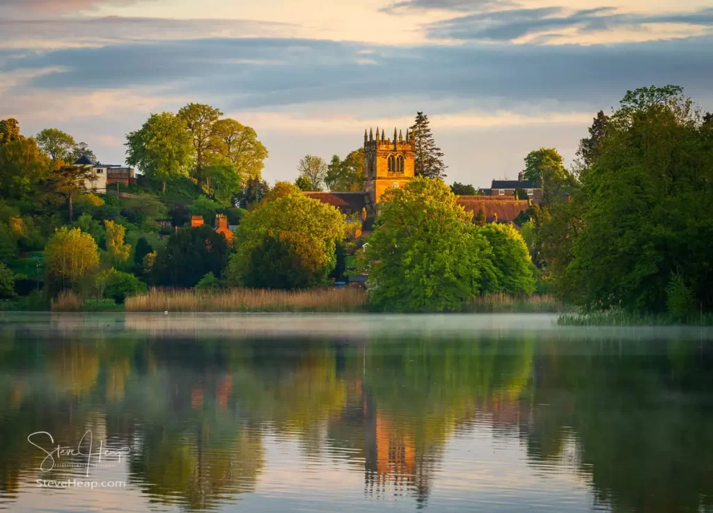 Mist forming on the lake at Ellesmere with St Mary's parish church in the distance