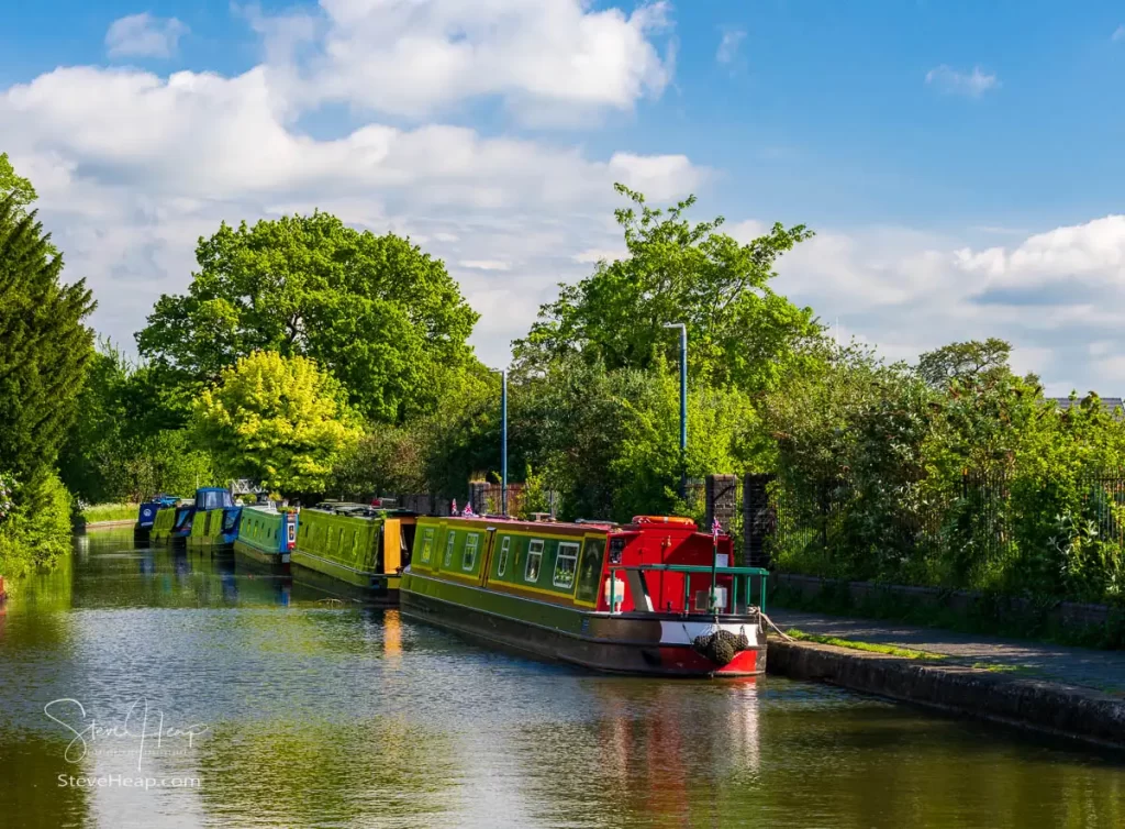 Colorful narrowboats on the canal in Ellesmere, Shropshire