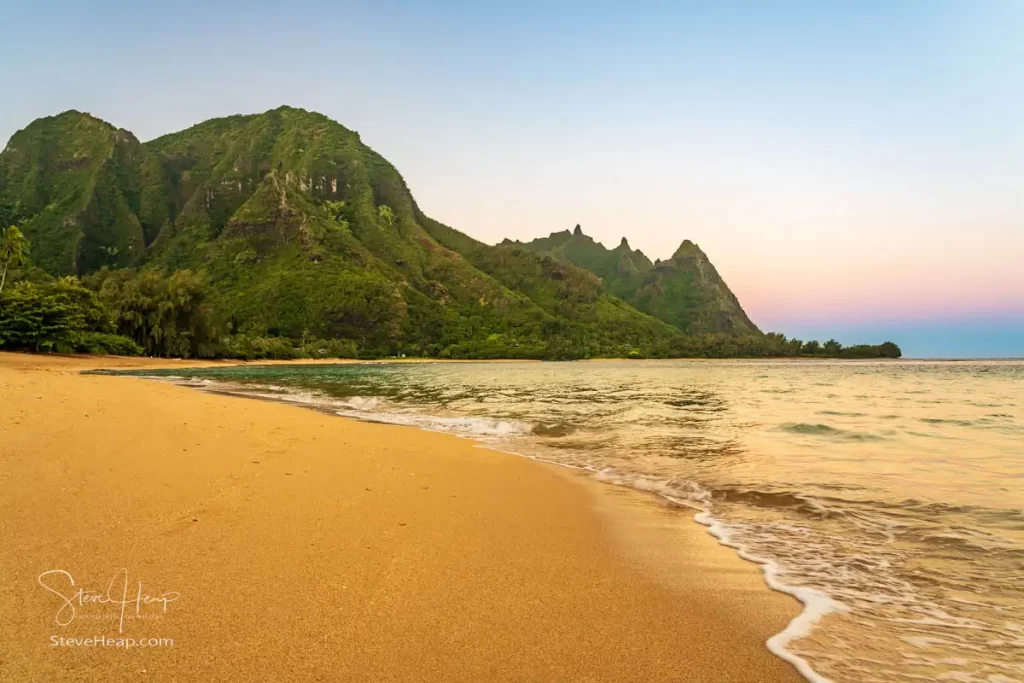 A perfect sandy beach leads off into the distance on Tunnels Beach. Prints in my online store