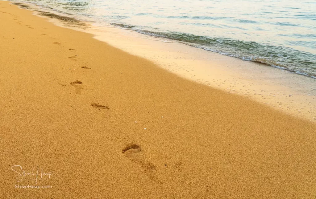 Footsteps leading off towards an unknown destination on Tunnels Beach on Kauai. Prints in my online store