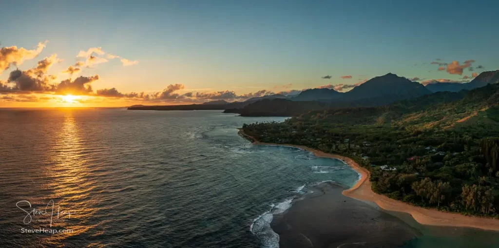 Sunrise over the distant Hanalei Bay just starts to illuminate the beach at Tunnels. Prints in my online store