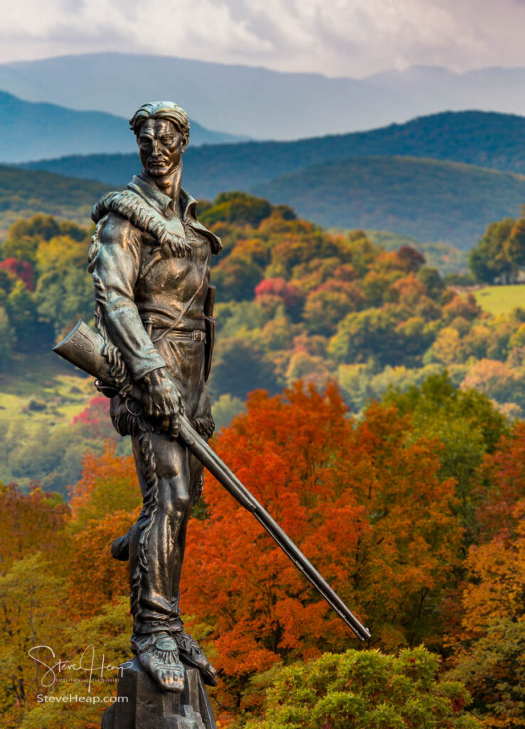 Famous WVU mascot, The Mountaineer, surveys the dramatic fall colors of the West Virginia mountains. Prints available here