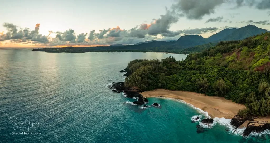 Sun rising over Hanalei with the rocks of Lumahai Beach in the foreground. Prints available in my online gallery.