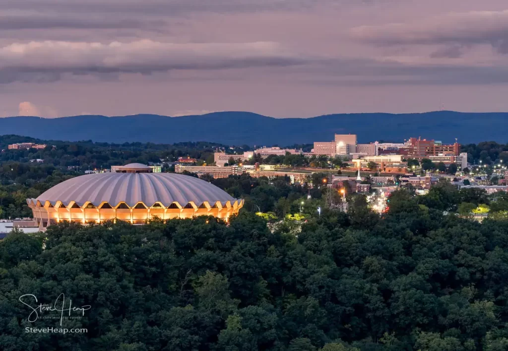 WVU Coliseum and JW Ruby Memorial Hospital in Morgantown as the distant sunset still lit up the clouds. Prints in my online store