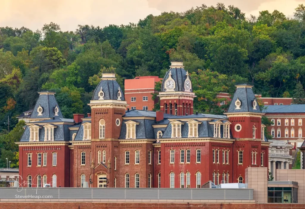 The old Woodburn Hall against the trees of downtown campus at West Virginia University in Morgantown
