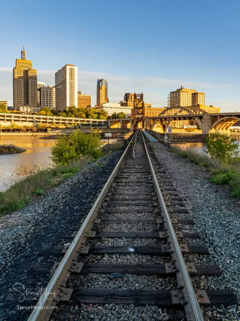 Railway tracks leading across the Mississippi River to downtown St Paul in Minnesota. Prints available in my online store