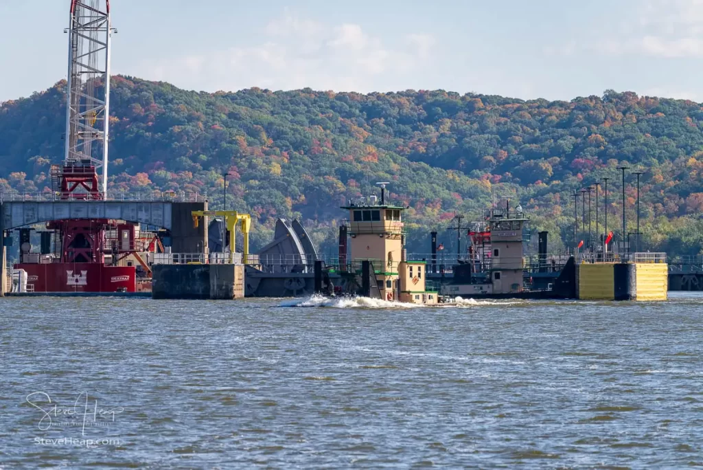 Large floating crane in place to lift one of the massive gates (in the center) that are used to control the flow of water down the river.