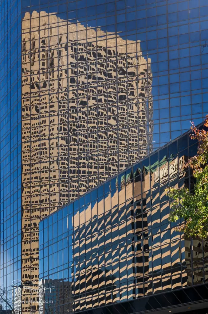 Reflection of office buildings in a glass skyscraper in St Louis, MO. Prints available in my online store