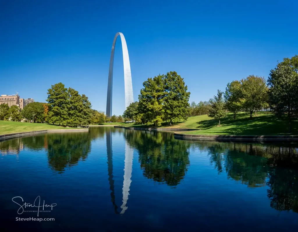 Gateway Arch reflected in the calm waters of the lake in the National Park in St Louis, Missouri. Prints available in my online store