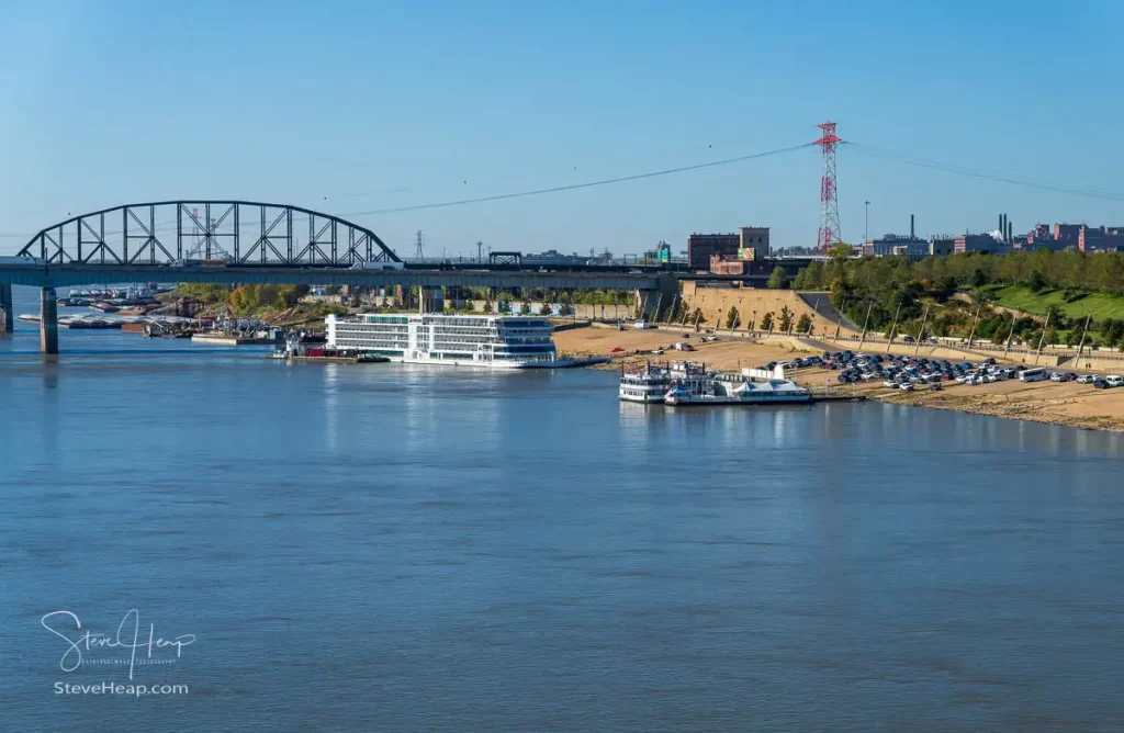 View from Eads bridge of the riverbank of the Mississippi in St Louis with the Viking Mississippi docked by the casino boats