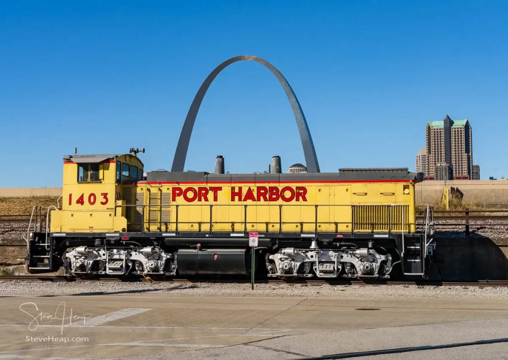 Port Harbor railway locomotive framed by the Gateway Arch of St Louis in East St Louis Illinois