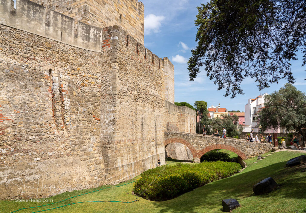 Tourists enter the Castelo de Sao Jorge in Alfama district of Lisbon in Portugal