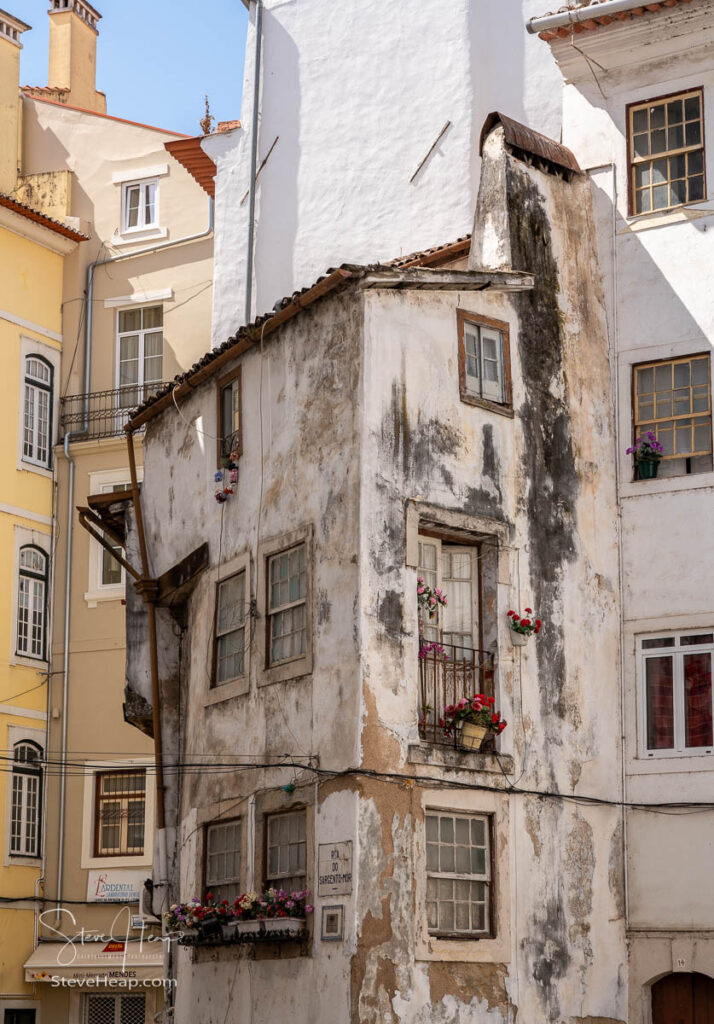 Crumbling and careworn old house in the back streets of Coimbra in Portugal