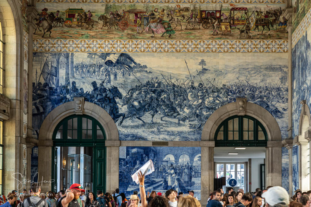 Decorative ceramic tiles show the history of Portugal in the main railway station entrance hall in Porto in Portugal