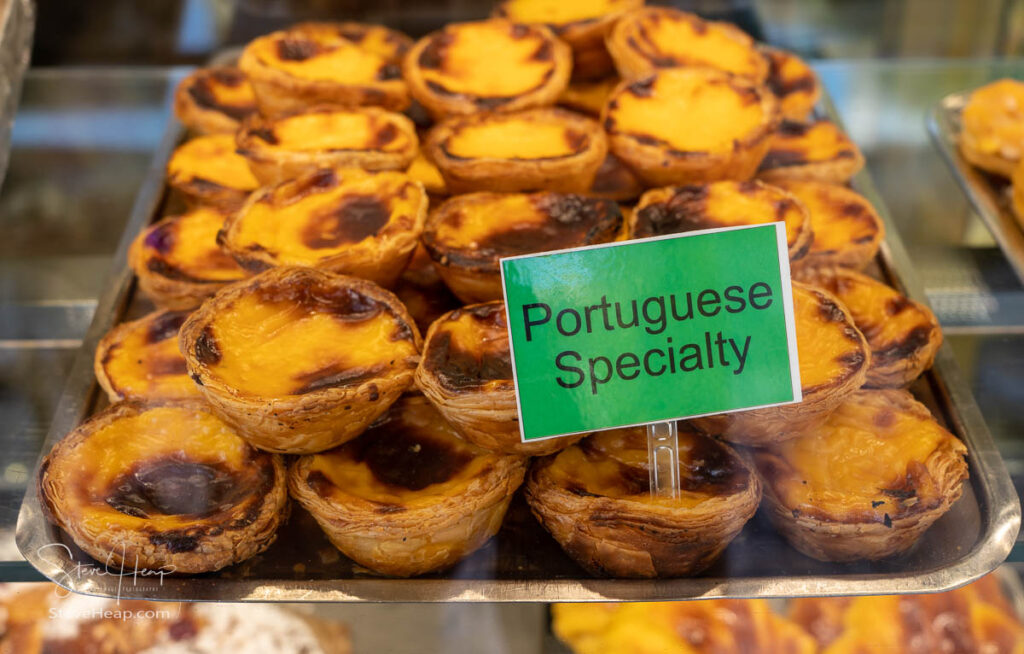 Display of Portuguese custard tarts or Pasteis de Nata in a bakery in Porto, Portugal