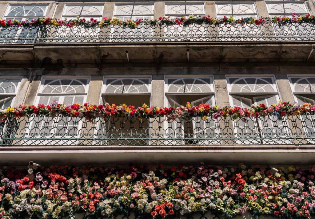 Flowers along the front and balconies of apartments and homes in downtown Porto