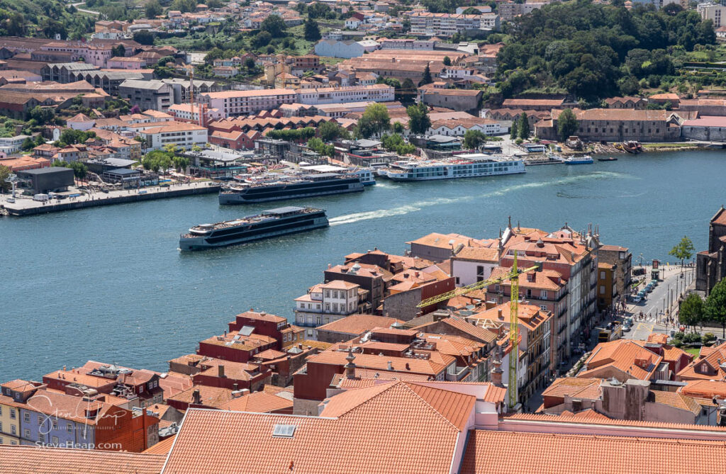 View of river cruise boats on the Douro River from the top of the Cathedral tower in Oporto