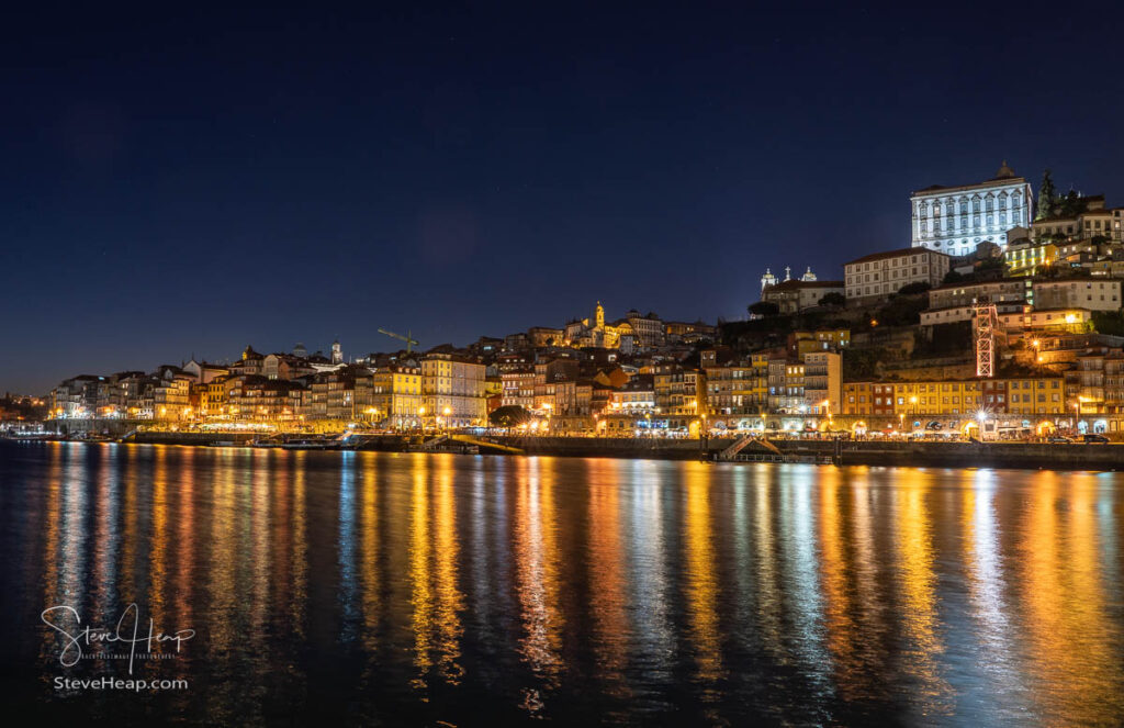 Night lights from the cityscape of Porto reflected in the waters of the river Douro