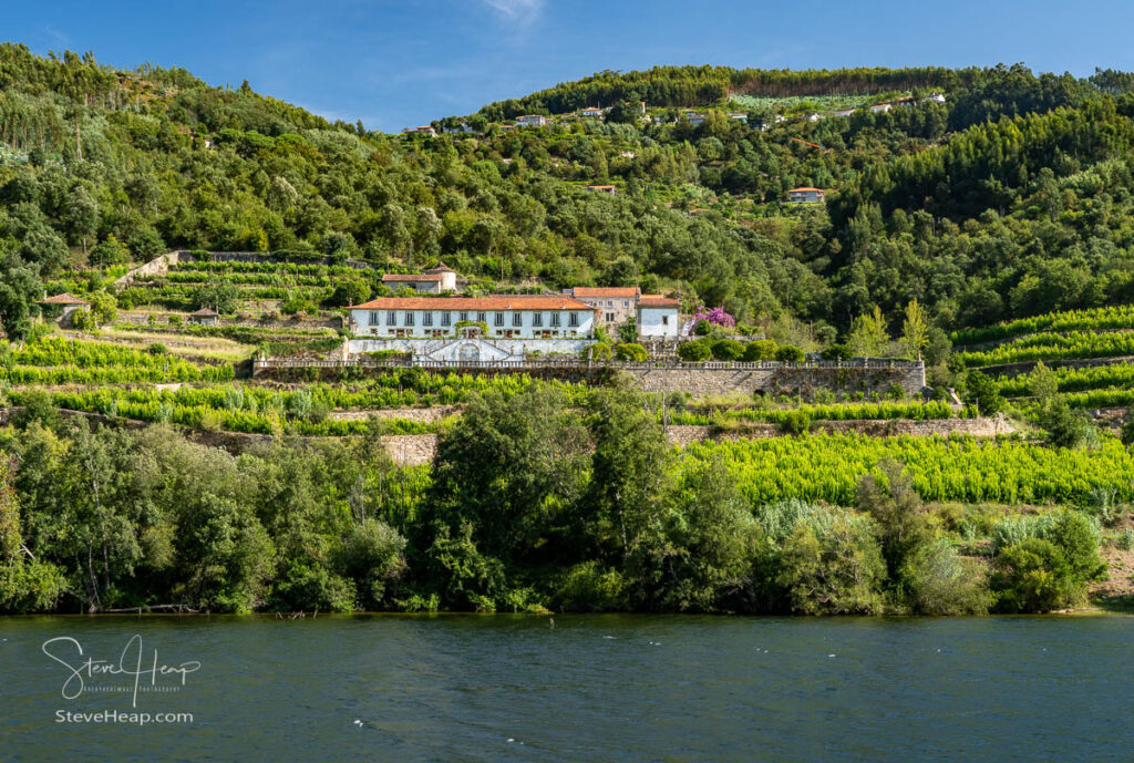 Whitewashed old Quinta or vineyard building on the banks of the River Douro in Portugal