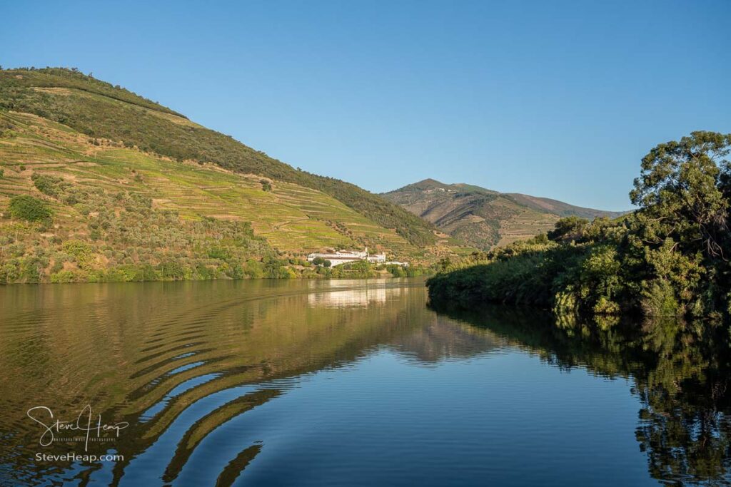 Whitewashed old Quinta or vineyard building on the banks of the River Douro in Portugal near Pinhao