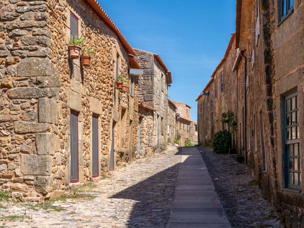 Old stone houses and narrow street in the ancient town of Castelo Rodrigo in Portugal