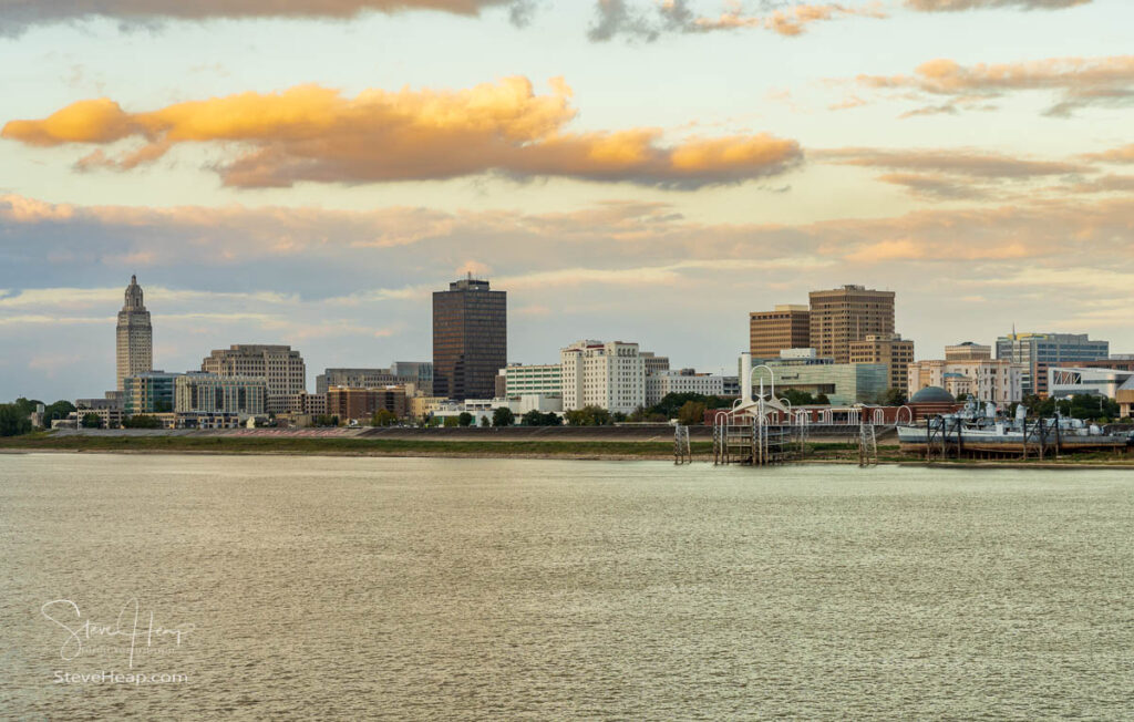 Sunset over the river barges and boats in Mississippi river to skyline of Baton Rouge, the state capital of Louisiana. Prints available in my online store