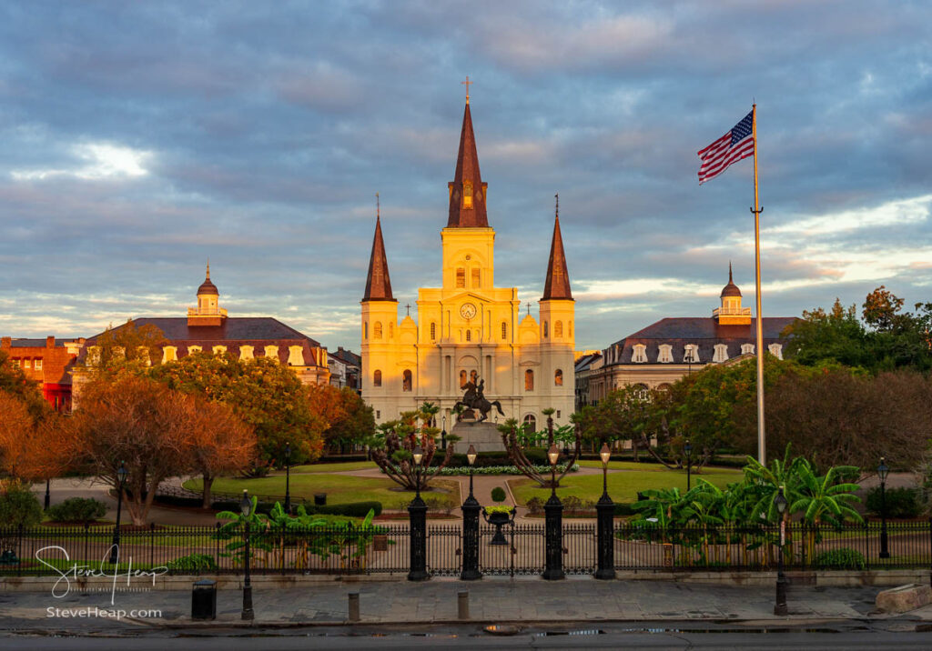 Rays from rising sun hit the facade of the Cathedral of St Louis, King of France with statue of Andrew Jackson in New Orleans. Prints in my online store