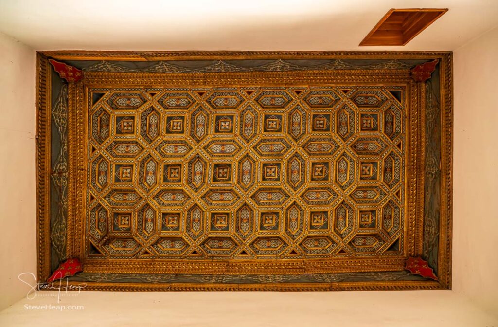 Ornate carved wooden ceiling inside the Casa de la Conchas or shells around the central courtyard in Salamanca