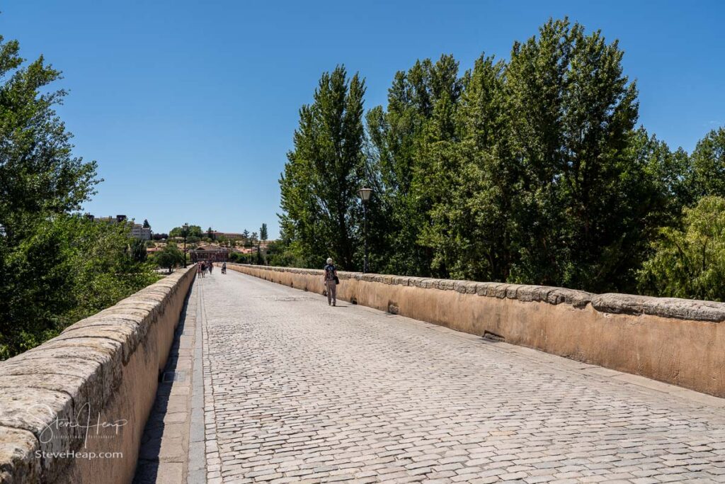 Cobbled surface of the old Roman Bridge leading away from the city of Salamanca in Spain