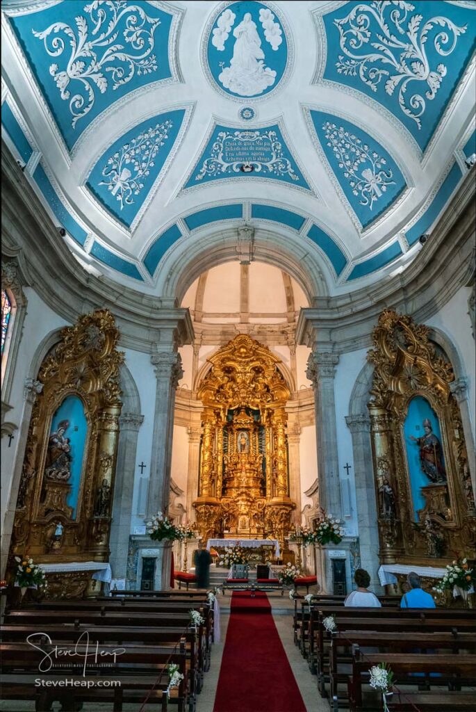Tourists view the interior of the Santuario de Nossa Senhora dos Remedios church in Lamego, Portugal