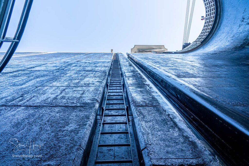 View towards the sky inside the very deep lock of the Barragem do Carrapatelo on Douro River in Portugal