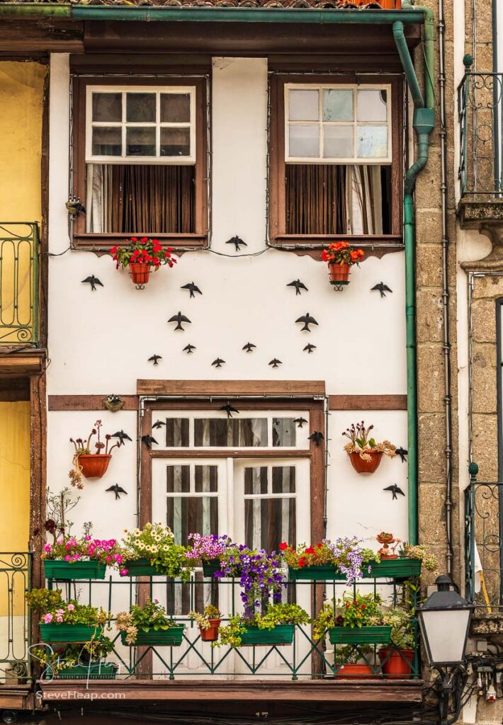 Traditional house decorated with flowers in the main square in Guimaraes