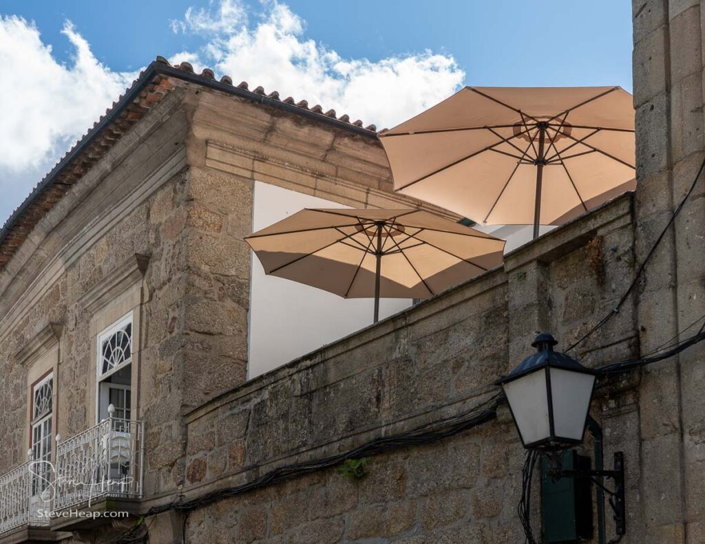 Umbrellas on rooftop restaurant Res Ves in the old town of Guimaraes