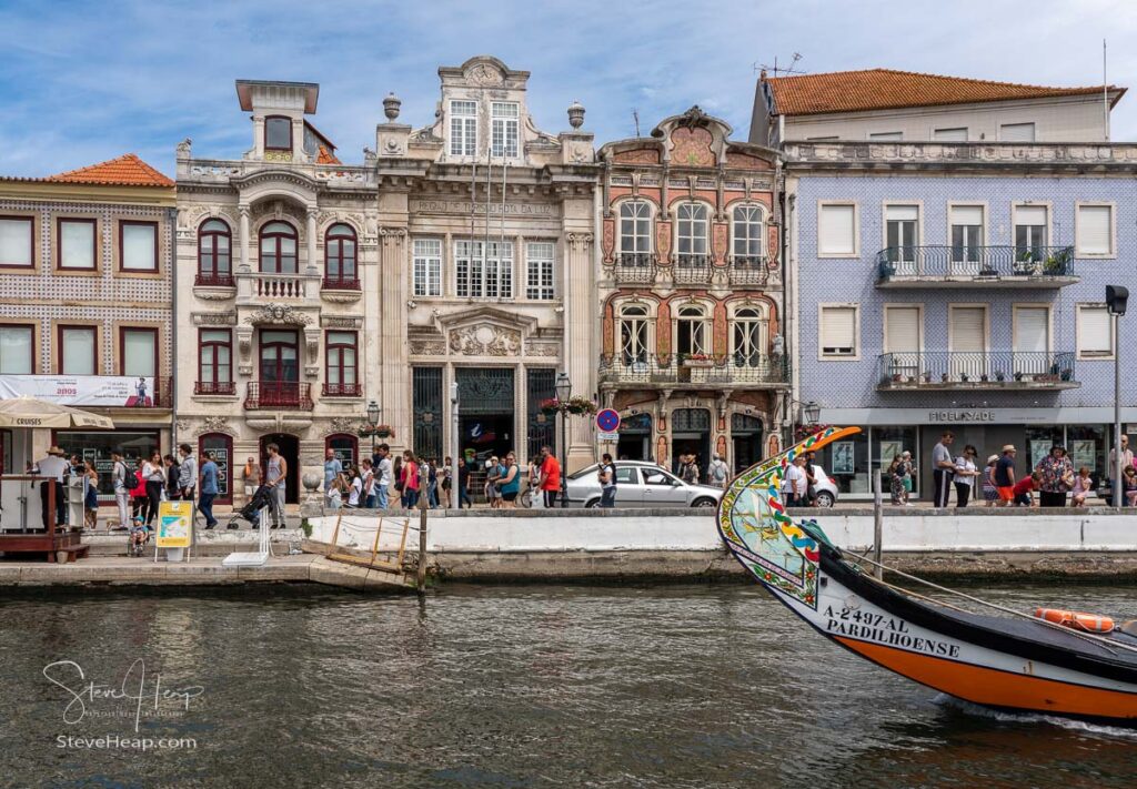 Main canal through the center of Aveiro with tile decorated houses and offices in Aveiro in Portugal