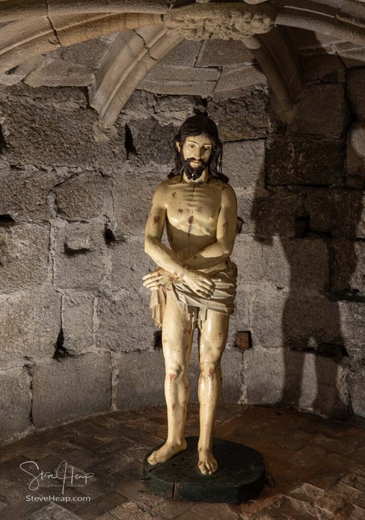 15th Century wooden carving of Jesus after his resurrection in the catacombs of the Cathedral in Viseu in Portugal. Prints available here