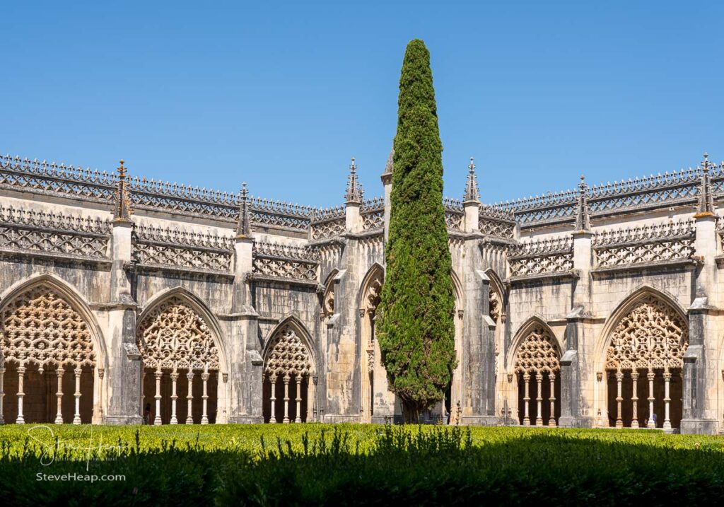 Ornate arches around the cloisters at the Batalha Monastery near Leiria in Portugal