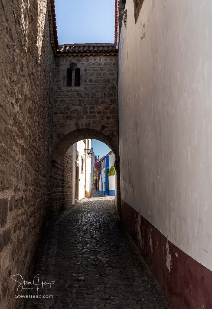 Stone archway in the old medieval walled city of Obidos in Portugal