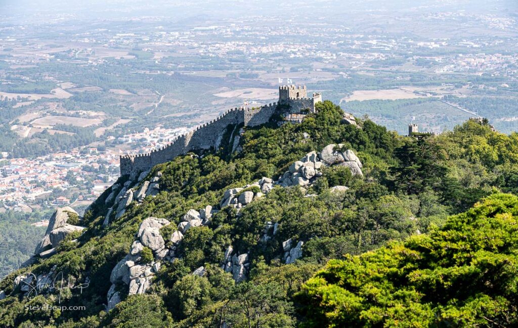 View of the Portuguese town of Sintra with the Moorish fortress or Castelo dos Mouros on the hilltop above the city