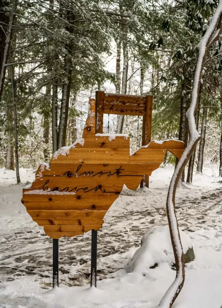 Almost heaven wooden West Virginia sign and swing at Coopers Rock State Forest