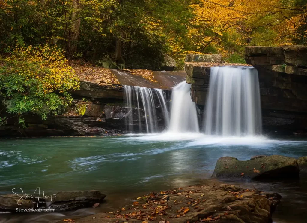 Cascade of waterfall into swimming hole with blurred motion on Deckers Creek running by Route 7 near Masontown in Preston County West Virginia